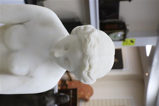 A Victorian style carved white marble figure of a woman pulling on her stocking, H.31in.